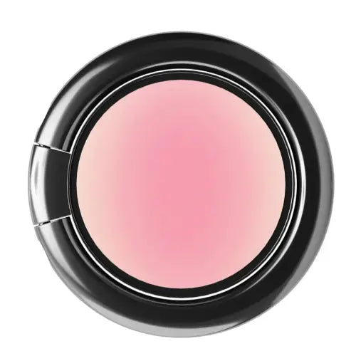 A round makeup compact showing a pressed blush or cream product in a soft pink shade, set against a clean white background.